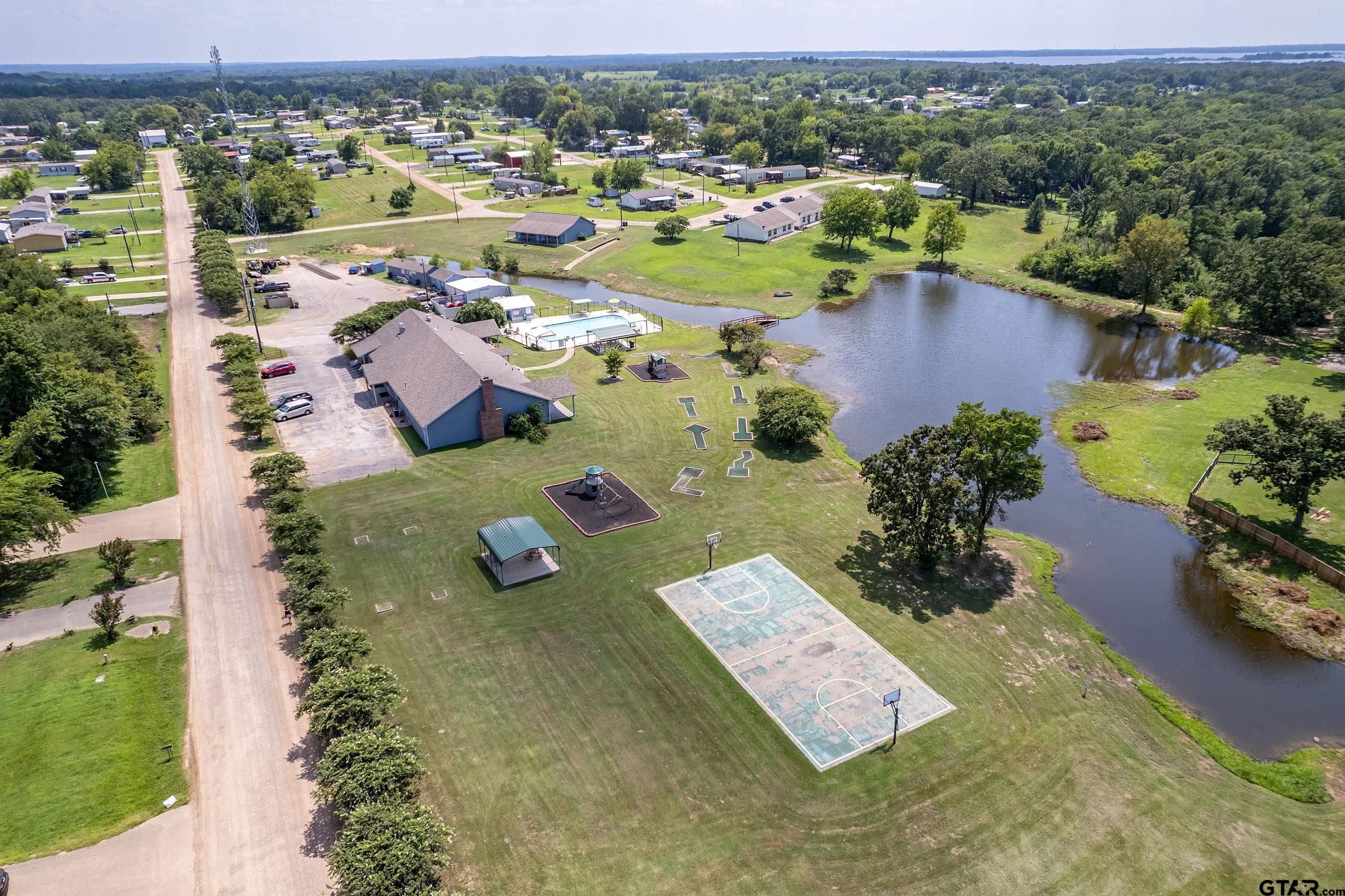 220 Broken Bow Quitman, TX 75783 - Photo 24 of 28 an aerial view of a house with garden
