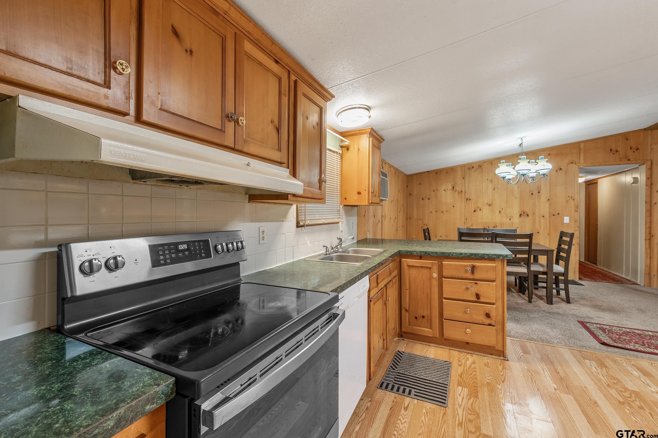 220 Broken Bow Quitman, TX 75783 - Photo 10 of 28 a kitchen with a stove and a sink