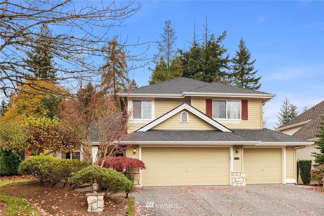 3013 213th Street Southeast Bothell, WA 98021 - Photo 1 of 25 a front view of a house with garden