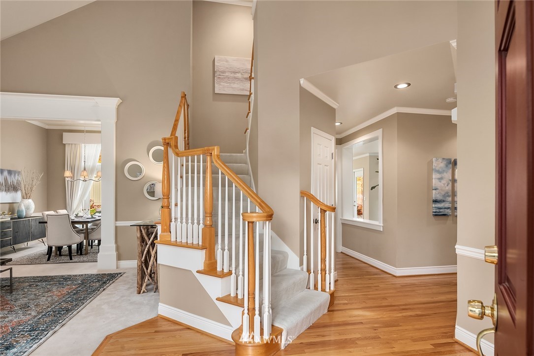 3013 213th Street Southeast Bothell, WA 98021 - Photo 3 of 25 a view of entryway and hall with wooden floor