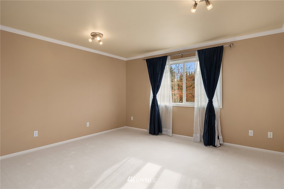 3013 213th Street Southeast Bothell, WA 98021 - Photo 23 of 25 an empty room with closet and windows
