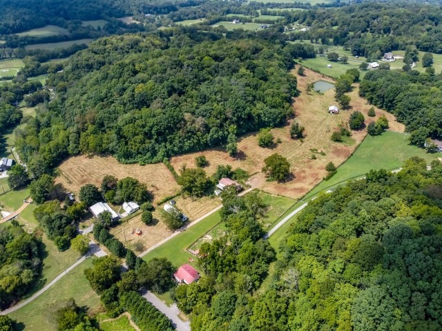 3442 Sweeney Hollow Road Franklin, TN 37064 - Photo 1 of 15 an aerial view of a house with a yard and lake view