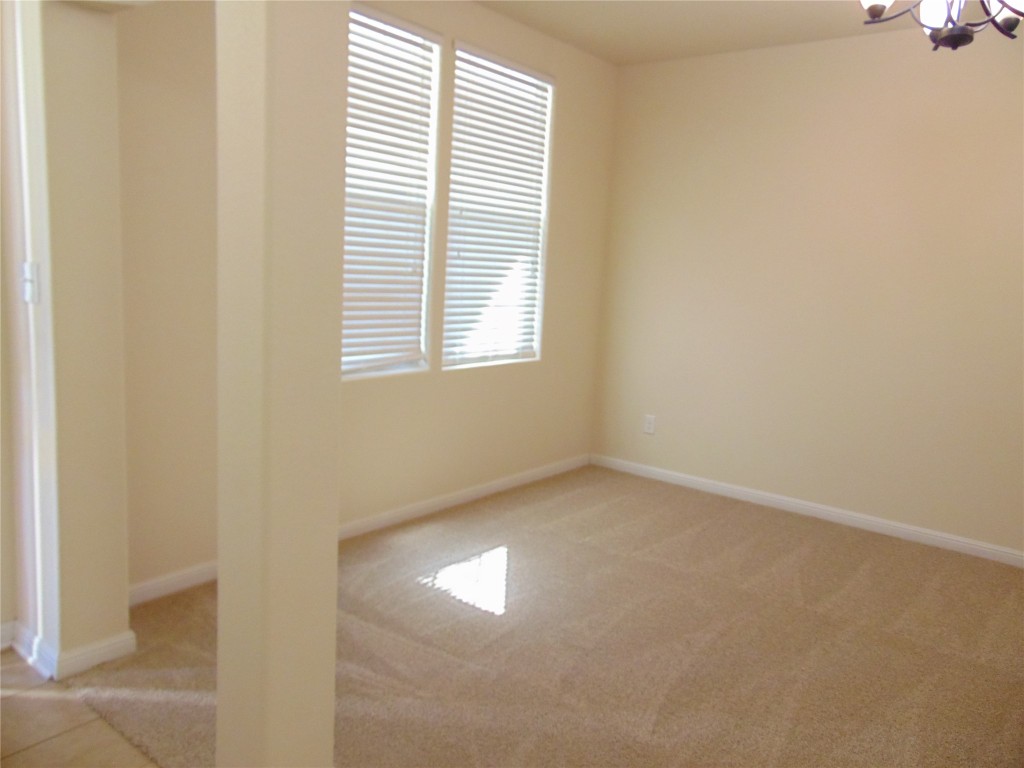 1076 Sanders Kyle, TX 78640 - Photo 2 of 12 an empty room with a window