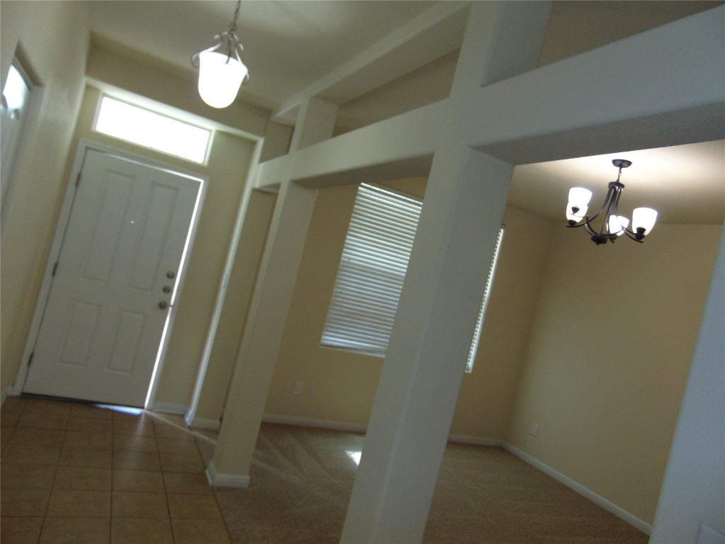 1076 Sanders Kyle, TX 78640 - Photo 4 of 12 a view of a livingroom with a chandelier