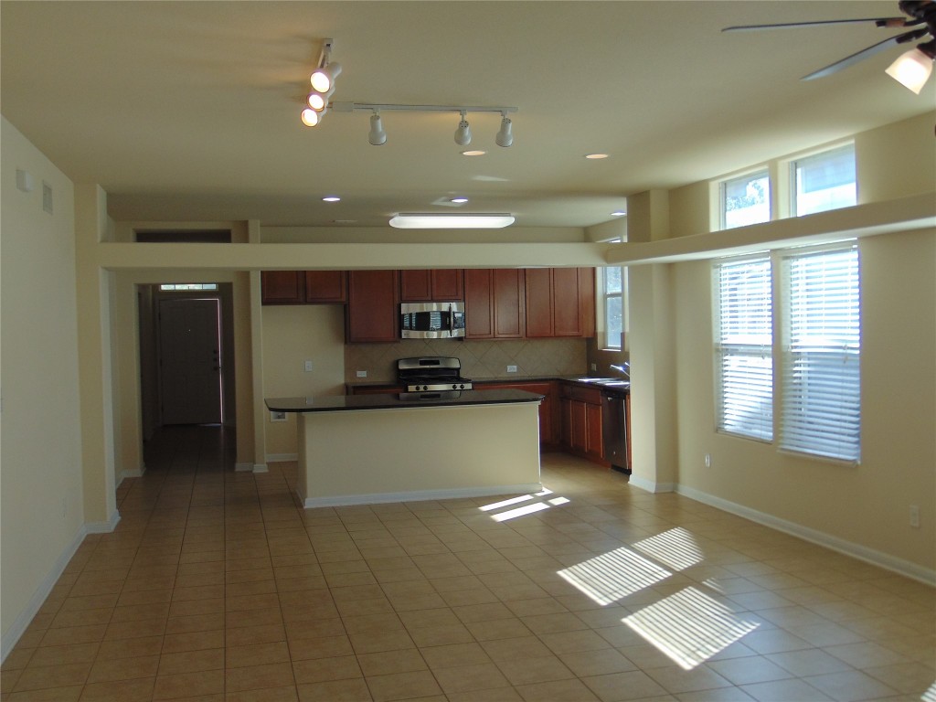1076 Sanders Kyle, TX 78640 - Photo 6 of 12 a large white kitchen with a large window