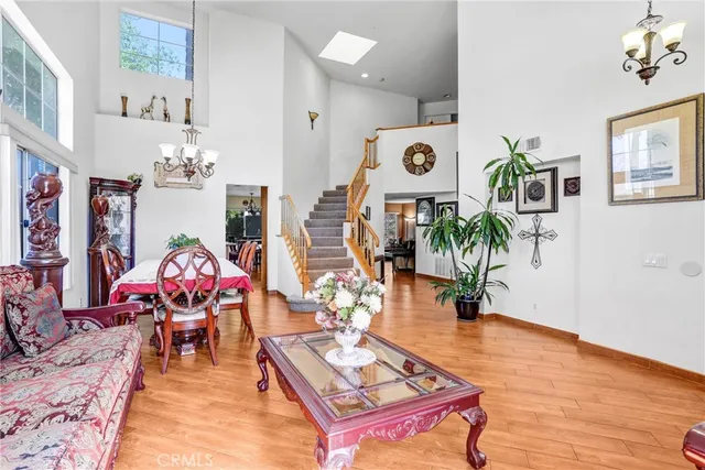 a living room filled with furniture and wooden floor