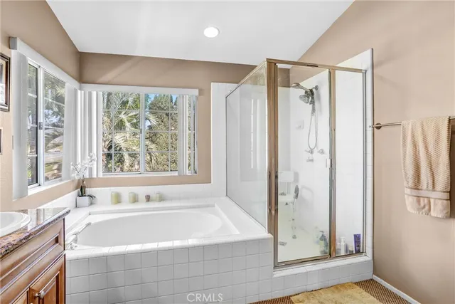 a bathroom with a bathtub and a shower