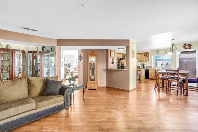 a living room with furniture and large windows