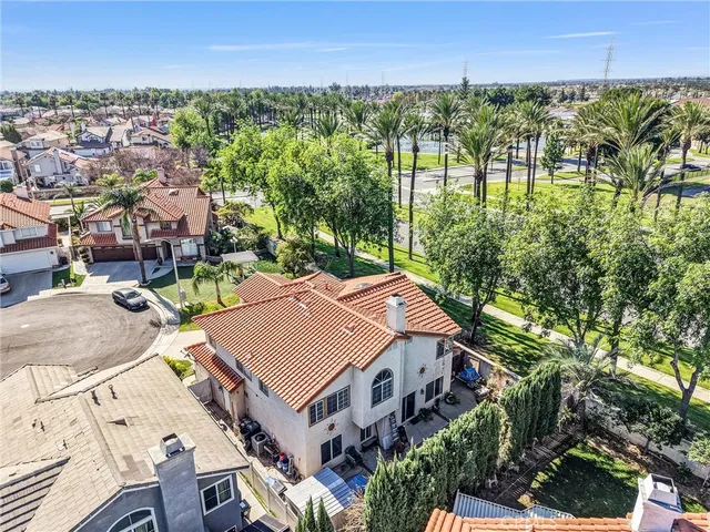 an aerial view of multiple houses with yard