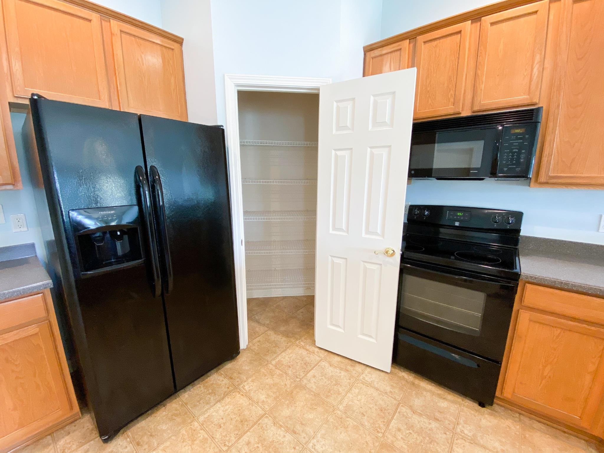 871 East Red House Branch Road St. Augustine, FL 32084 - Photo 14 of 23 a kitchen with stainless steel appliances granite countertop a refrigerator and a sink