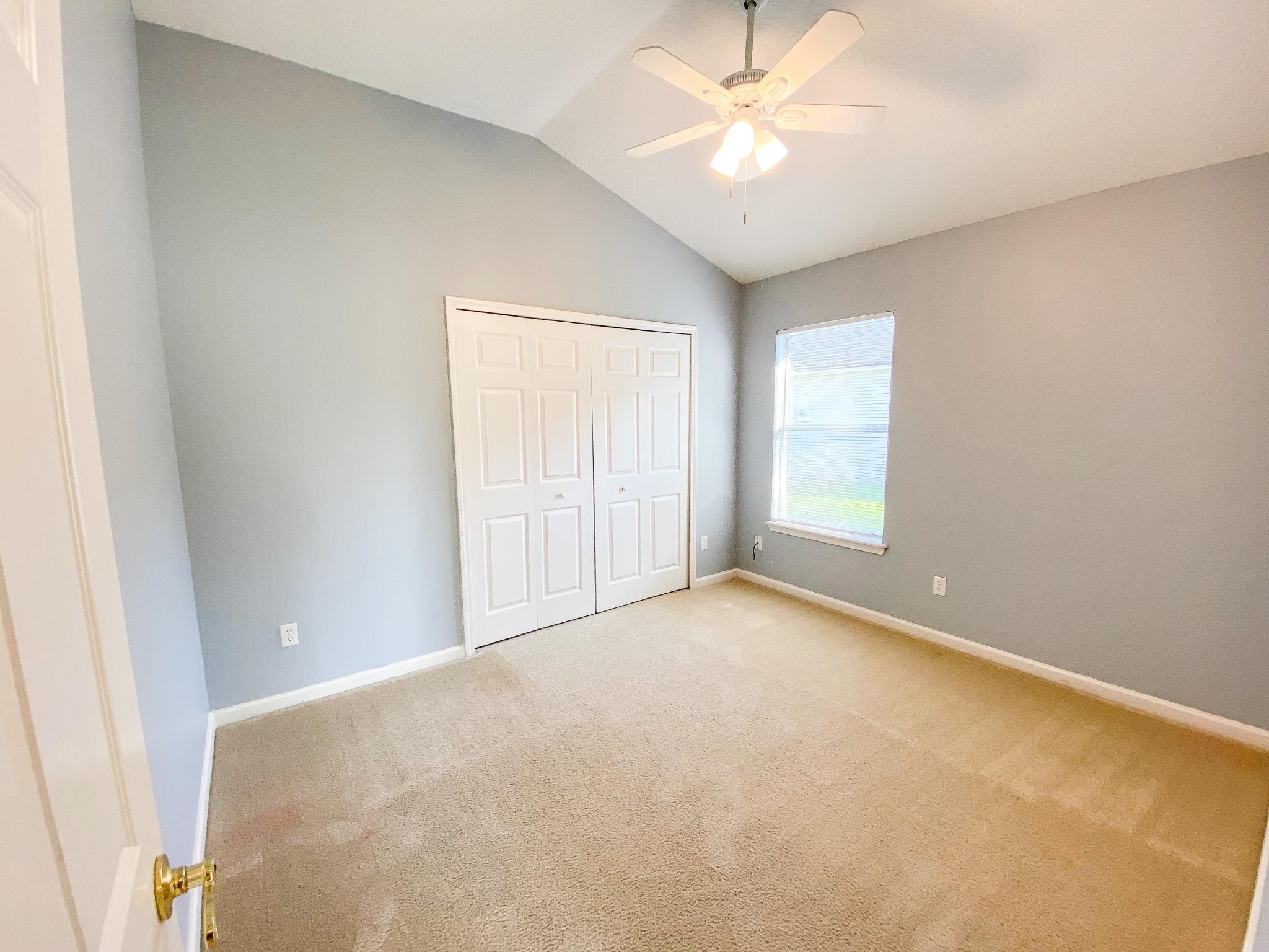 871 East Red House Branch Road St. Augustine, FL 32084 - Photo 19 of 23 an empty room with windows and fan