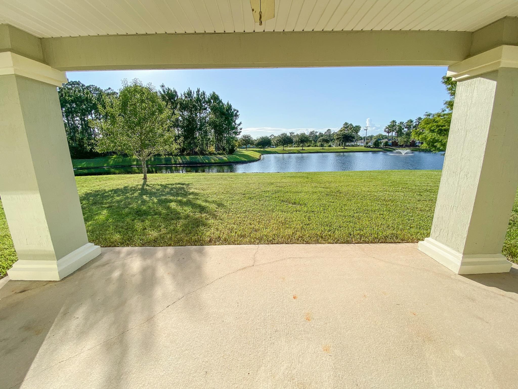 871 East Red House Branch Road St. Augustine, FL 32084 - Photo 20 of 23 a view of a lake with houses in the back