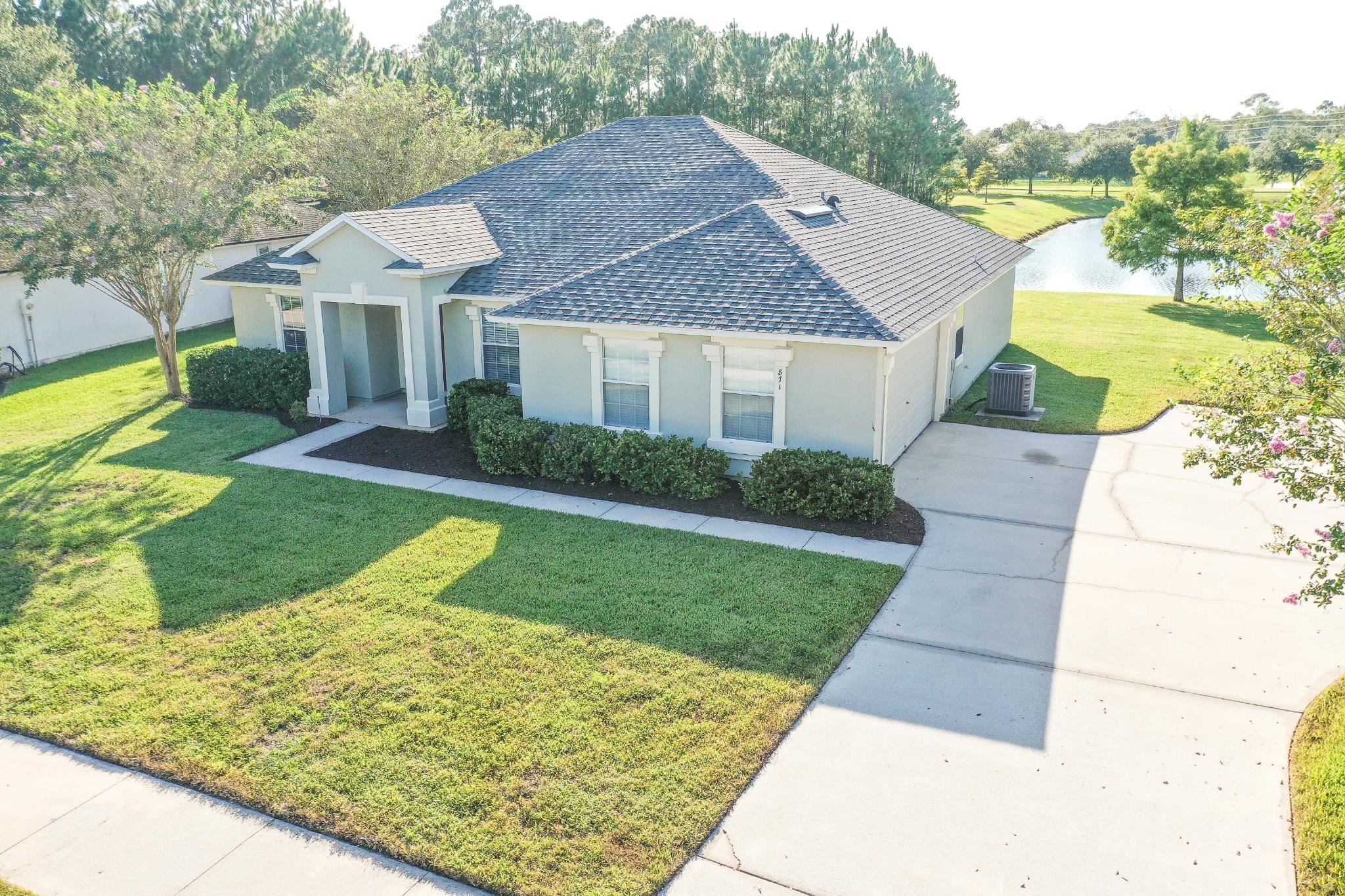 871 East Red House Branch Road St. Augustine, FL 32084 - Photo 3 of 23 a view of a house with a yard