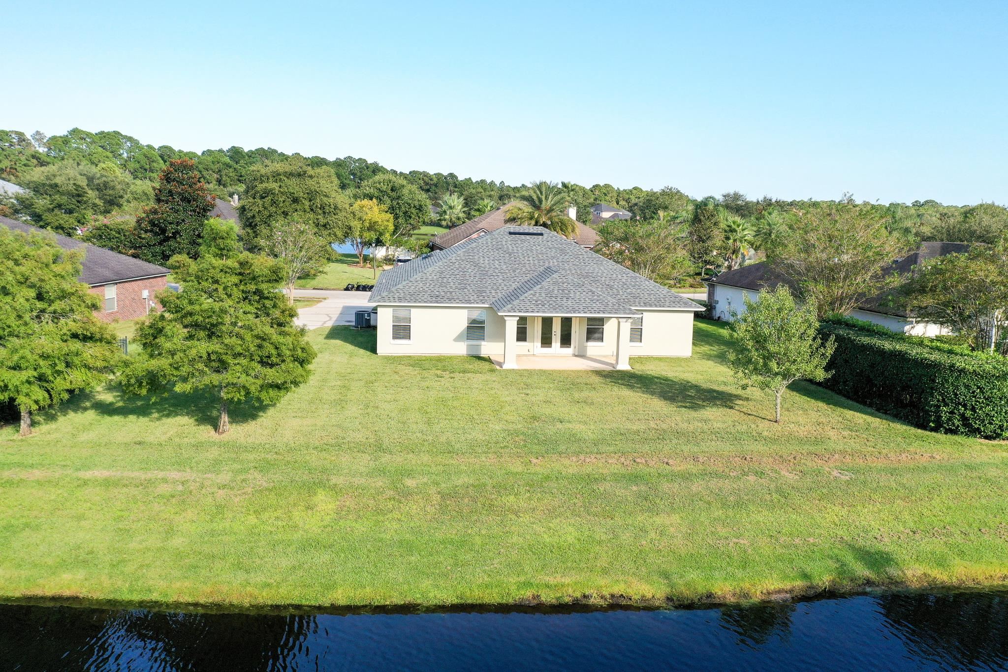 871 East Red House Branch Road St. Augustine, FL 32084 - Photo 21 of 23 a aerial view of a house with a yard