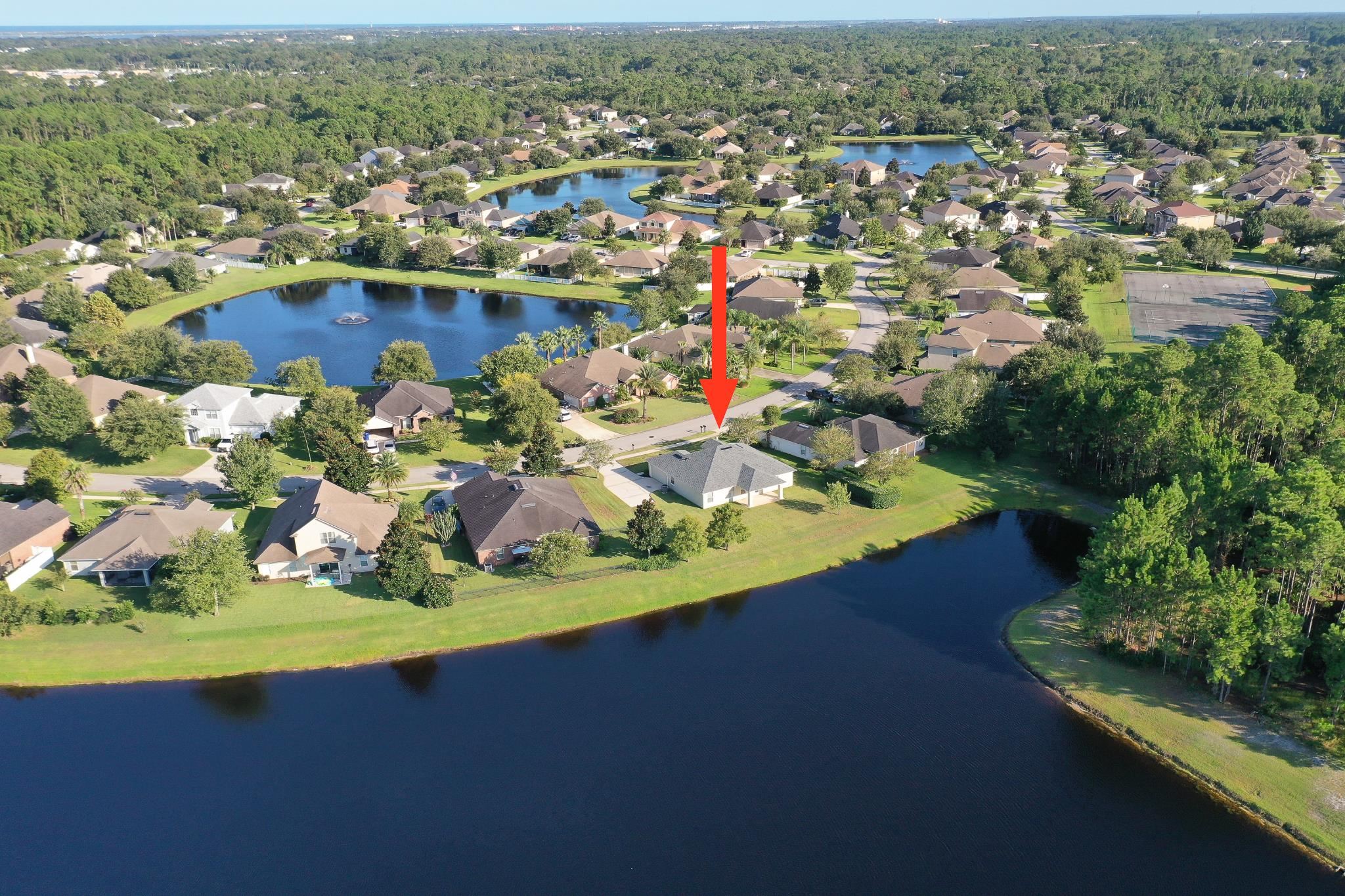 871 East Red House Branch Road St. Augustine, FL 32084 - Photo 22 of 23 an aerial view of a house with a lake view