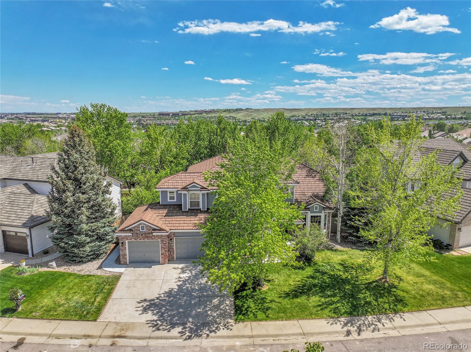 a view of a garden with a building in the background