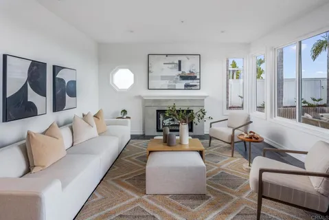 a living room with furniture and a fireplace