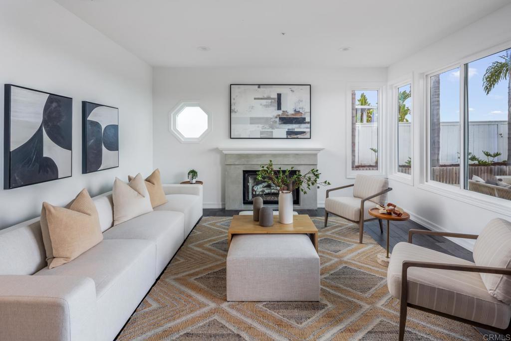 608 Crest Drive Encinitas, CA 92024 - Photo 15 of 32 a living room with furniture and a fireplace