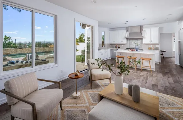 a dining room with furniture and a window