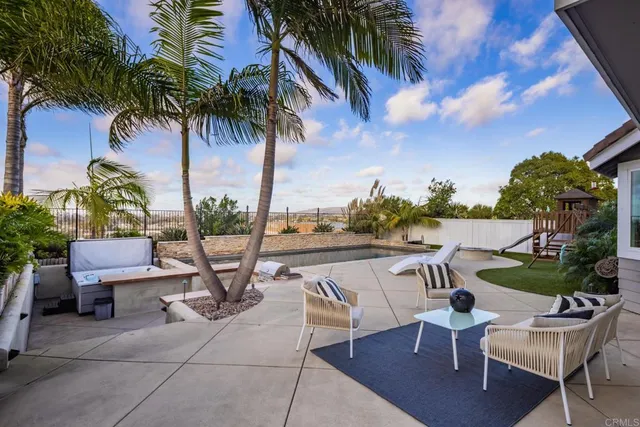 a view of a patio with swimming pool
