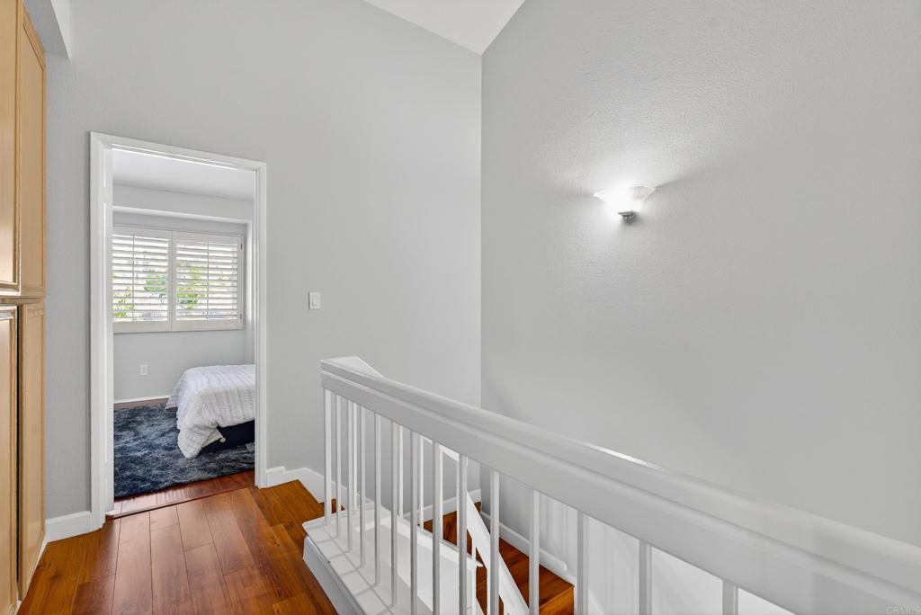 8927 Windham Court Spring Valley, CA 91977 - Photo 9 of 28 a view of a hallway with entryway wooden floor and front door