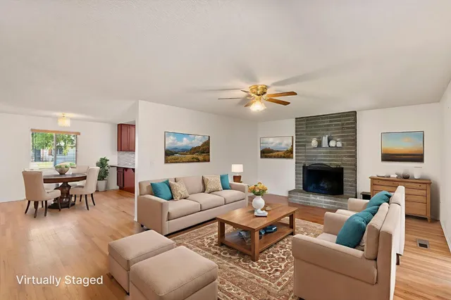 a living room with furniture and a fireplace