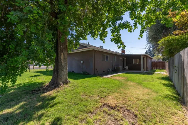 a backyard of a house with lots of green space