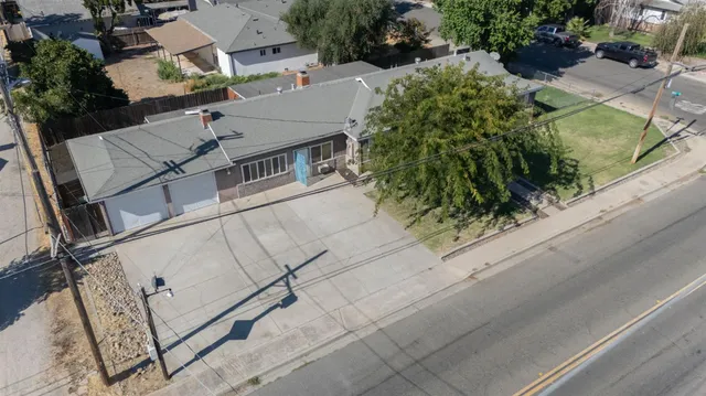 an aerial view of residential houses with outdoor space