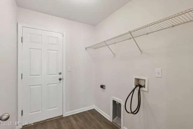 a view of a storage & utility room with wooden floor