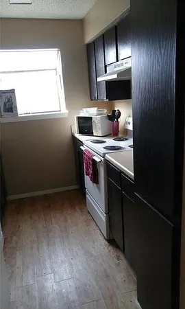 a kitchen with stainless steel appliances granite countertop a stove and a refrigerator