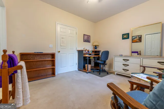 a living room with furniture and a chair