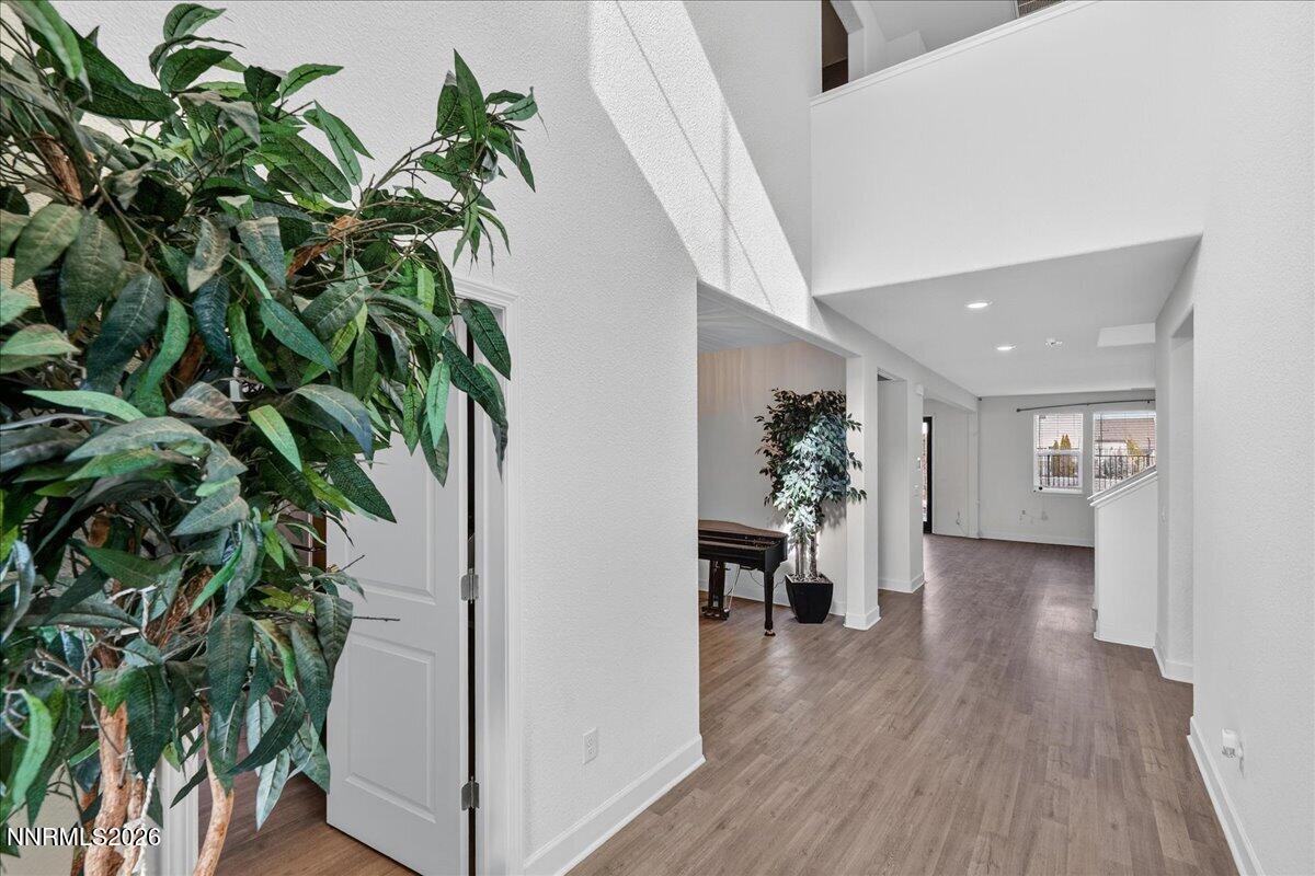 1280 Harness Drive Sparks, NV 89436 - Photo 3 of 46 a view of a hallway with wooden floor and plant