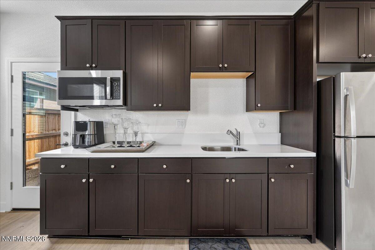 1280 Harness Drive Sparks, NV 89436 - Photo 39 of 46 a kitchen with a sink and refrigerator