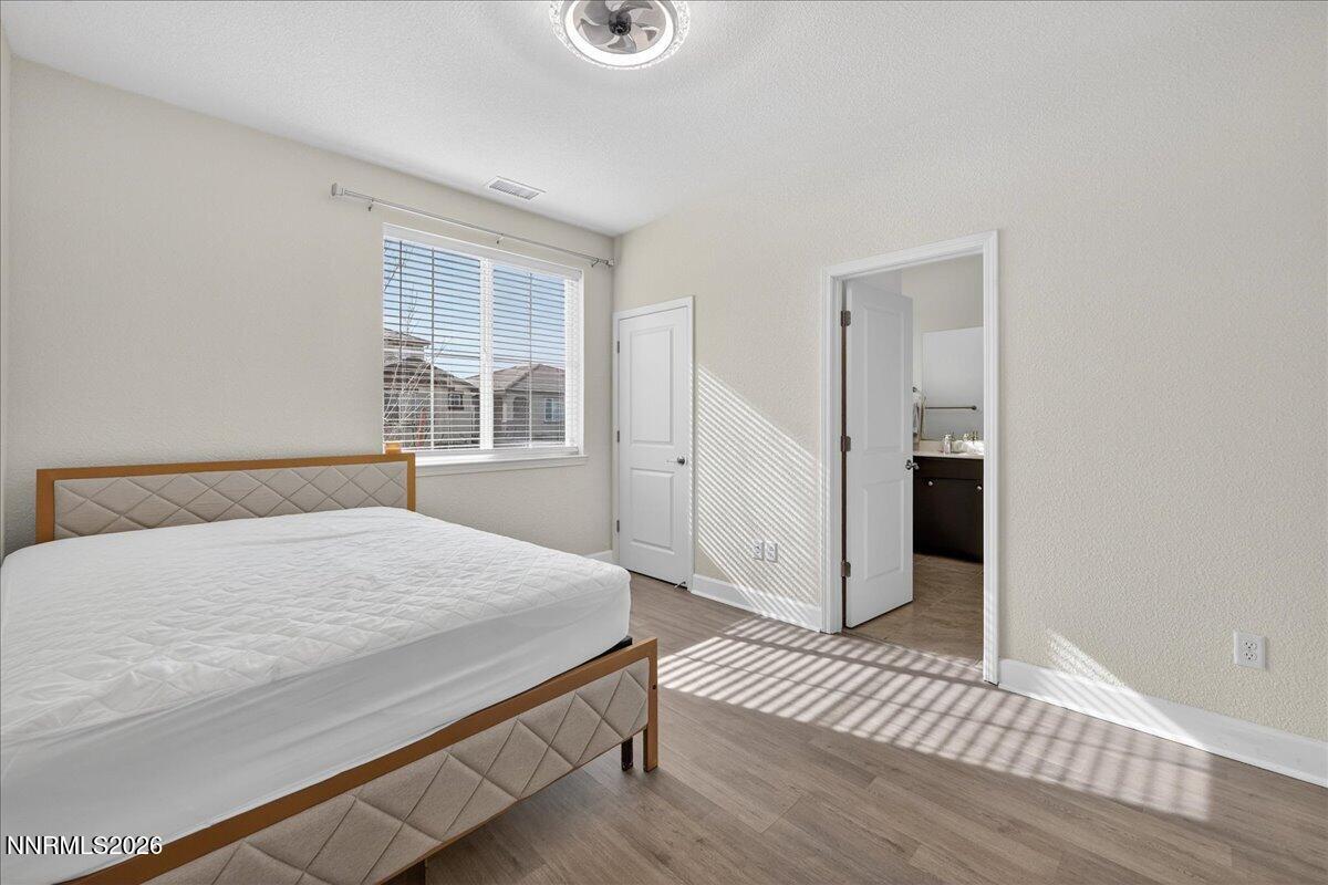 1280 Harness Drive Sparks, NV 89436 - Photo 40 of 46 a bedroom with a bed closet and a window