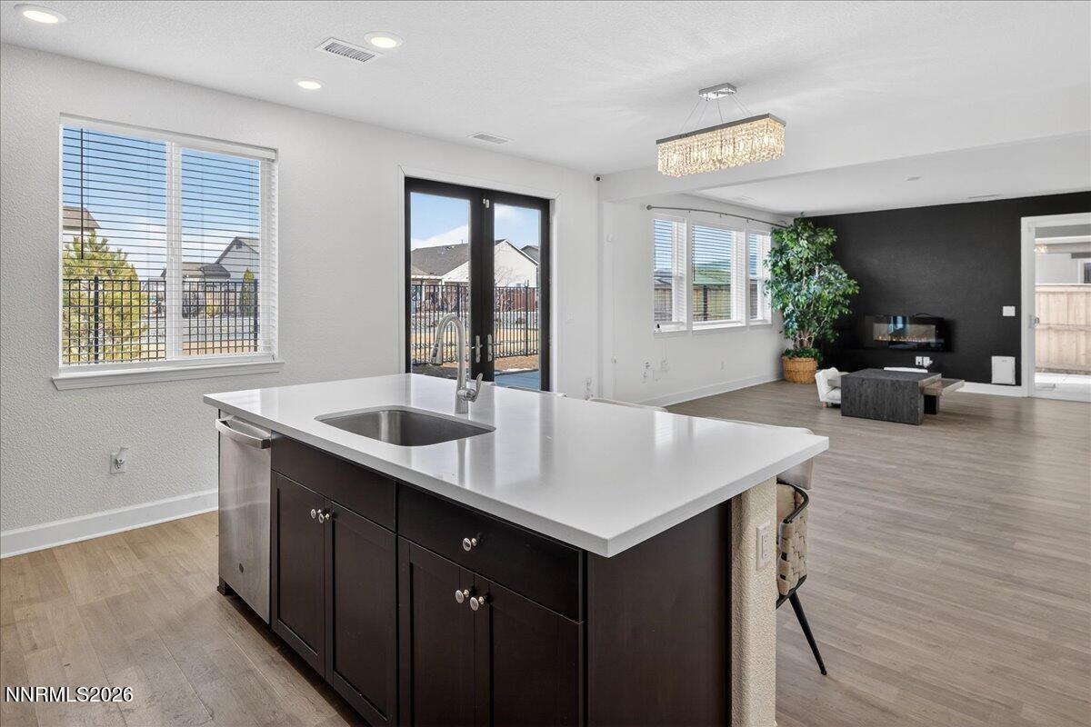 1280 Harness Drive Sparks, NV 89436 - Photo 9 of 46 a view of kitchen island a sink and wooden floor