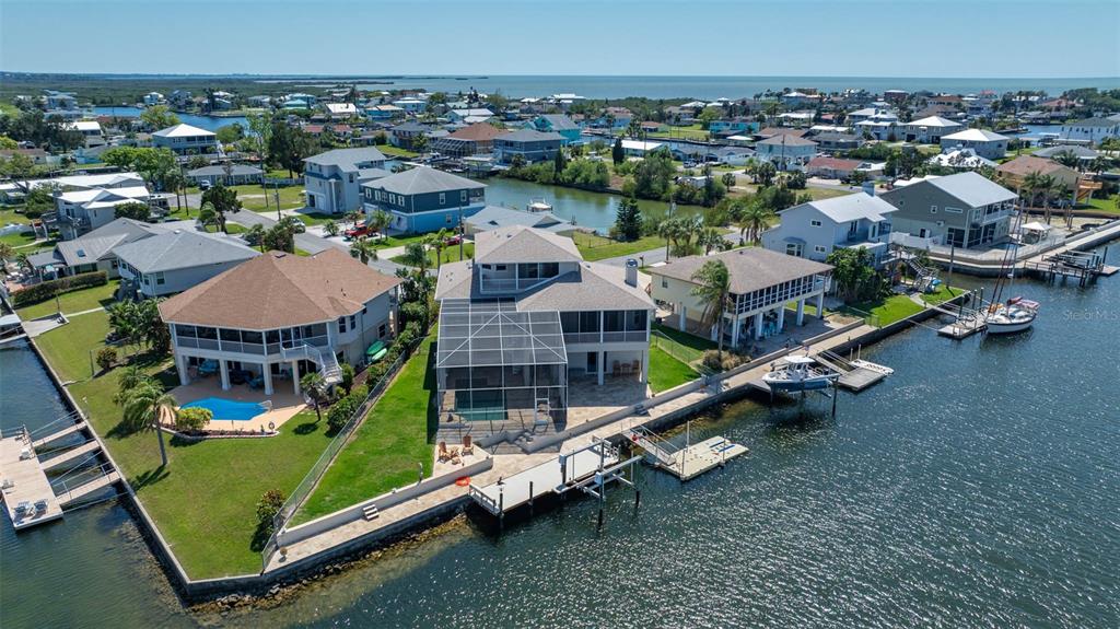 an aerial view of a house with a big yard