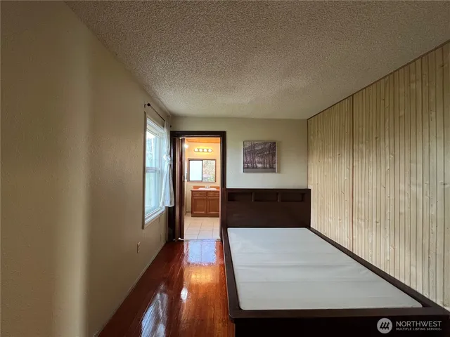 a view of entryway with wooden floor