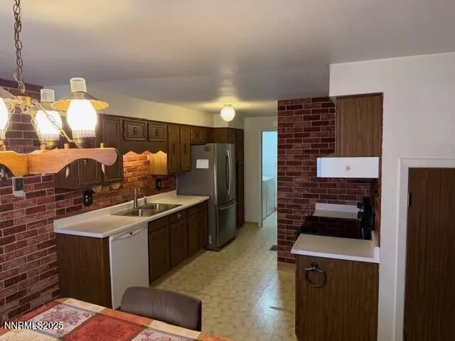 a kitchen that has a sink and a stove