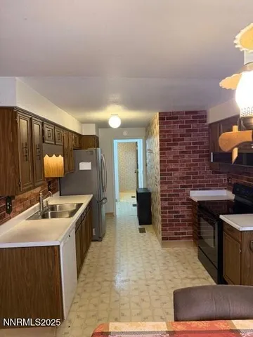 a kitchen with a sink and a stove