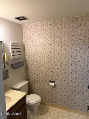 a bathroom with a toilet and a sink