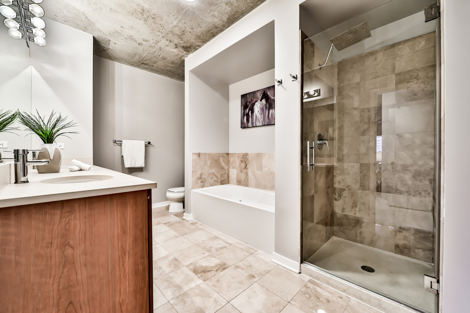 611 South Wells Street, Unit 1903 Chicago, IL 60607 - Photo 17 of 28 a bathroom with a bathtub and a sink