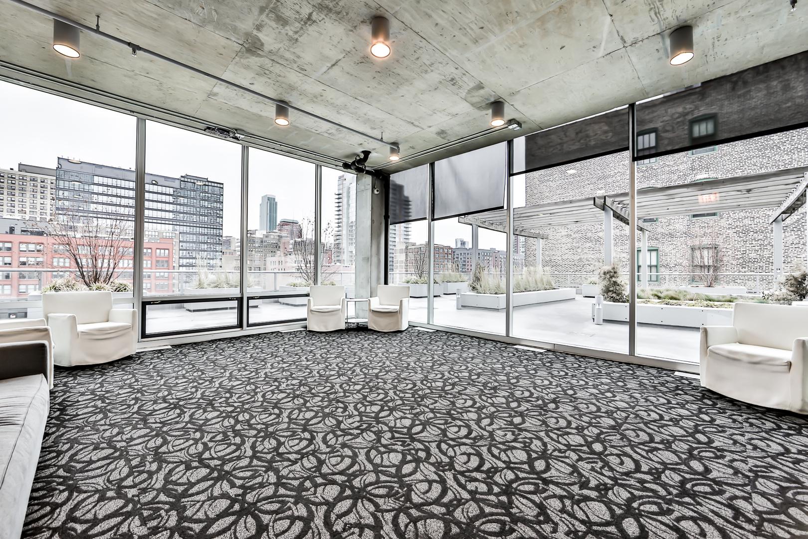 611 South Wells Street, Unit 1903 Chicago, IL 60607 - Photo 27 of 28 a living room with a large window