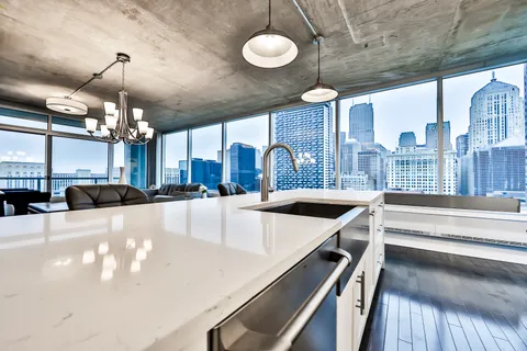 a large kitchen with a chandelier