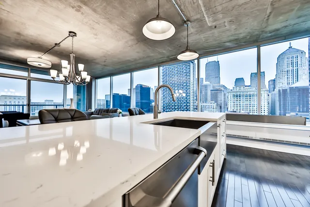 a large kitchen with a chandelier