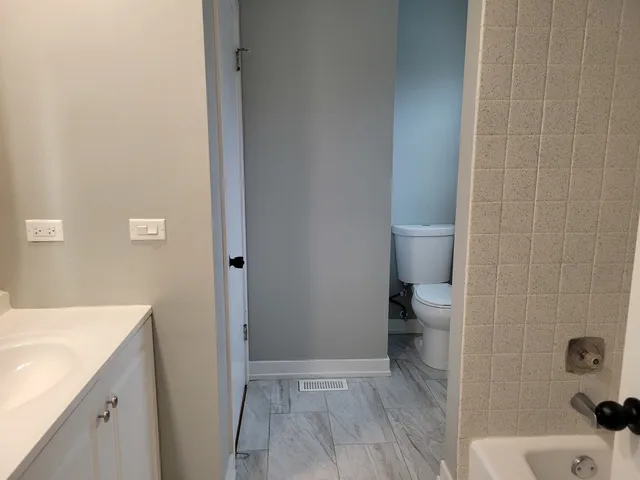 a bathroom with a sink and toilet