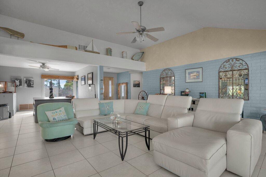 43761 Port Maria Road Bermuda Dunes, CA 92203 - Photo 11 of 50 a living room with furniture and a chandelier