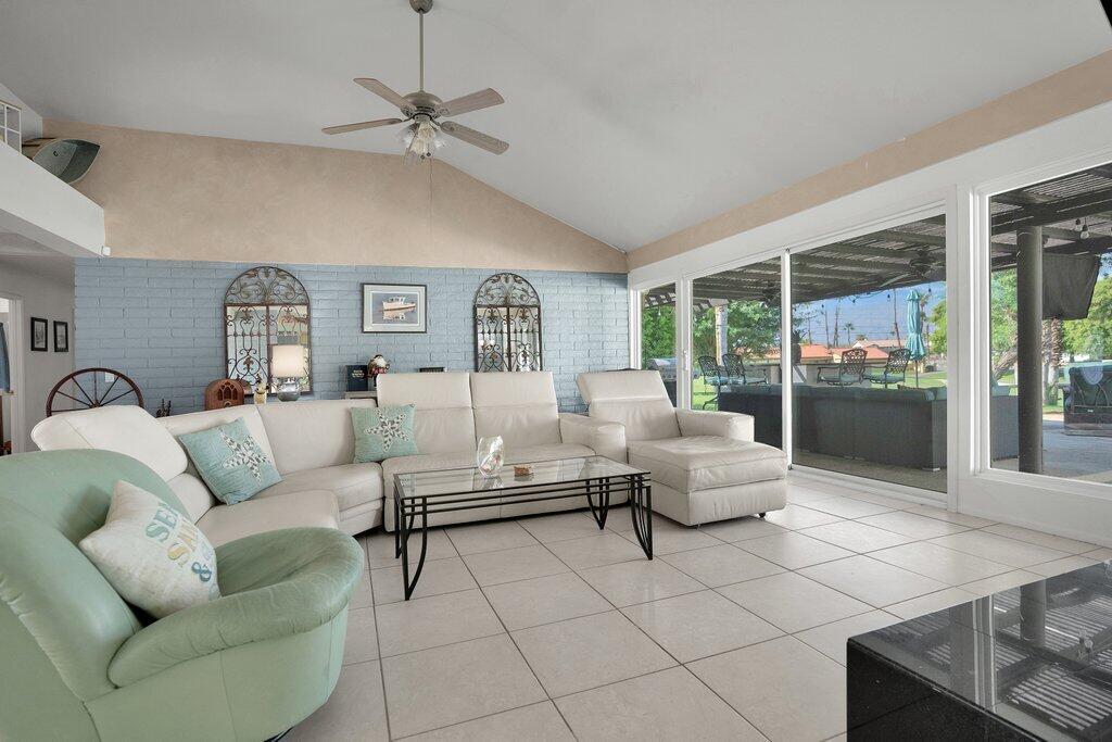 43761 Port Maria Road Bermuda Dunes, CA 92203 - Photo 12 of 50 a living room with furniture and a large window