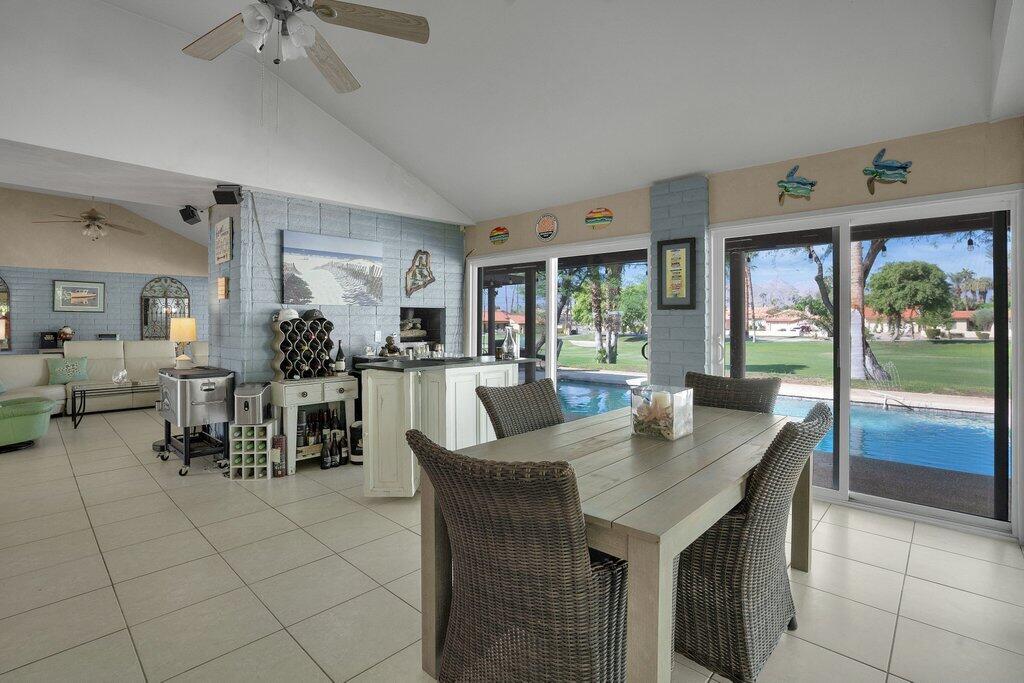 43761 Port Maria Road Bermuda Dunes, CA 92203 - Photo 15 of 50 a view of a dining room with furniture window and outside view