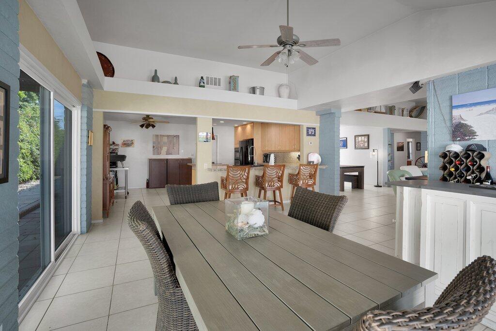 43761 Port Maria Road Bermuda Dunes, CA 92203 - Photo 20 of 50 a view of a dining room and livingroom with furniture wooden floor a chandelier