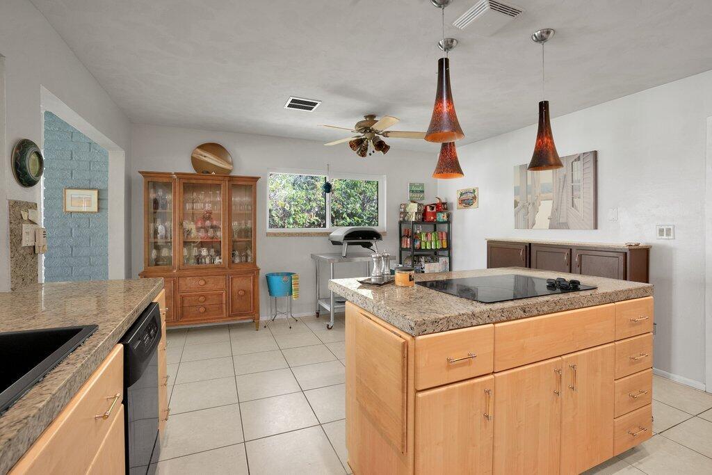 43761 Port Maria Road Bermuda Dunes, CA 92203 - Photo 23 of 50 a kitchen that has a sink and a stove